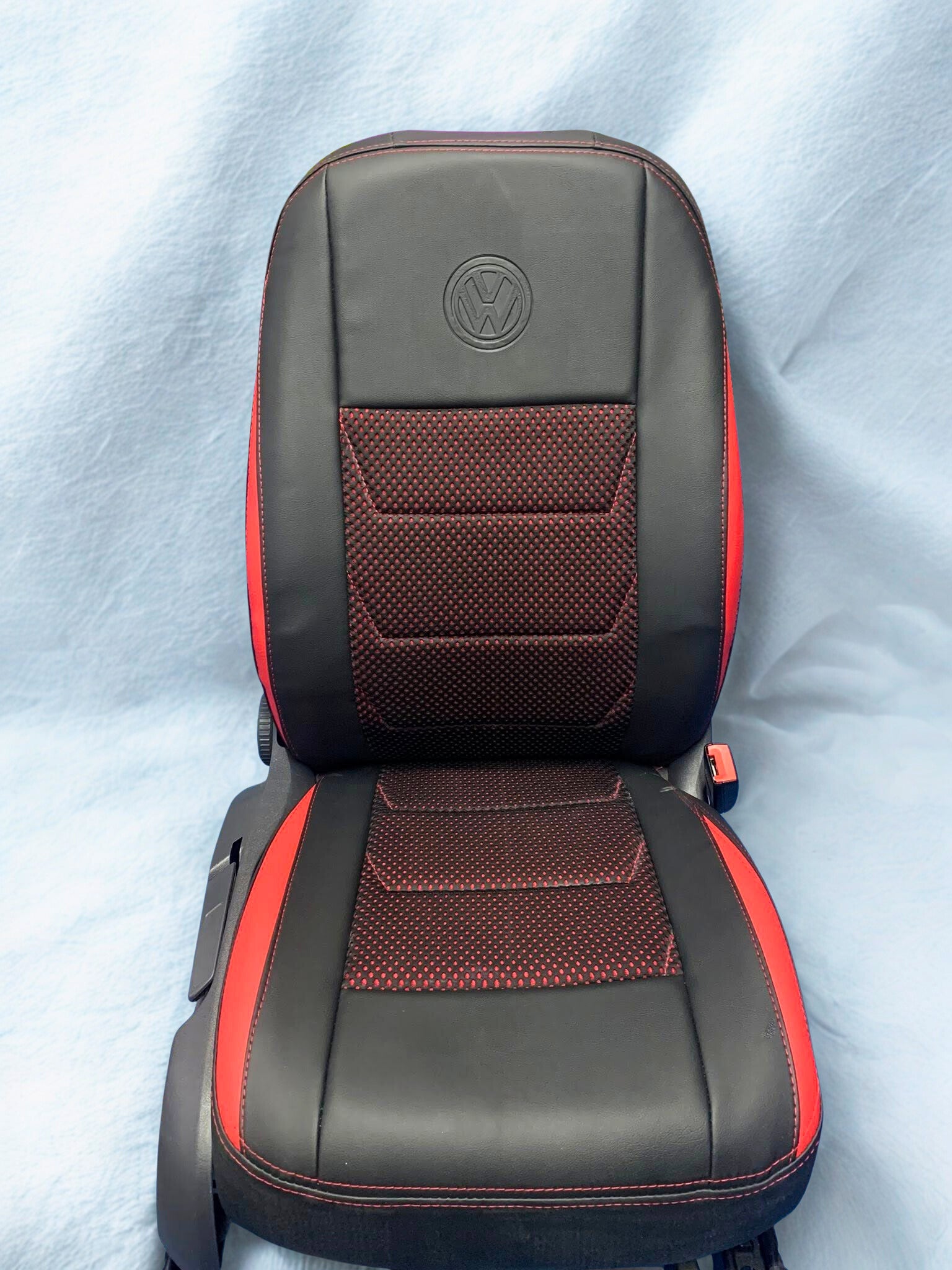 red and black seat cover for a Volkswagen golf. the seat covers help protect the seat, is easy to clean, and fits car seat covers, covers for seats, automobile car seat covers, baby car sit covers
